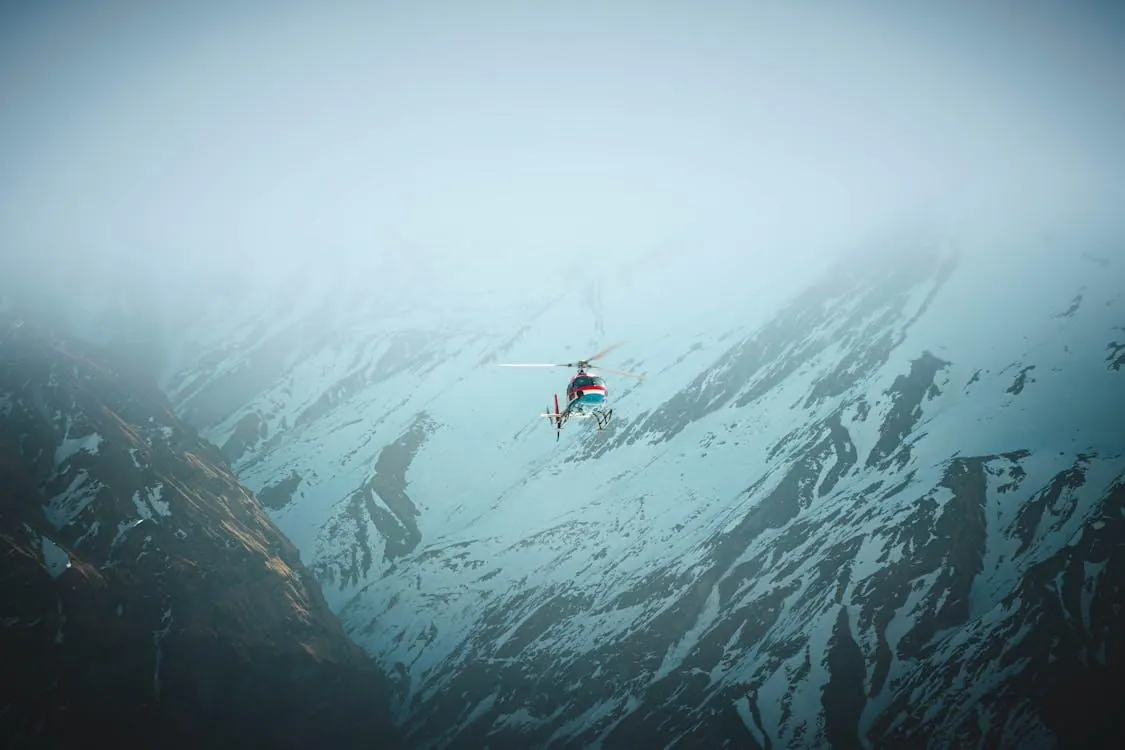 Helicopter flying through Himalayan mountains near Muktinath