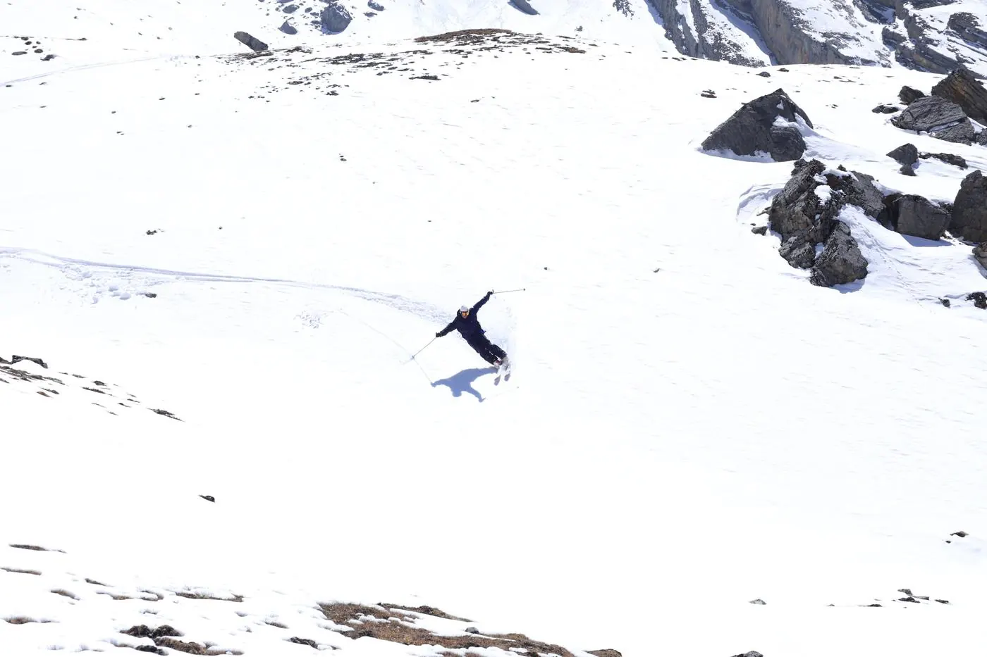 Skier making big turn on Nepal high altitude snow